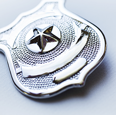 . Image - Silver law enforcement badge. Click tile image to view